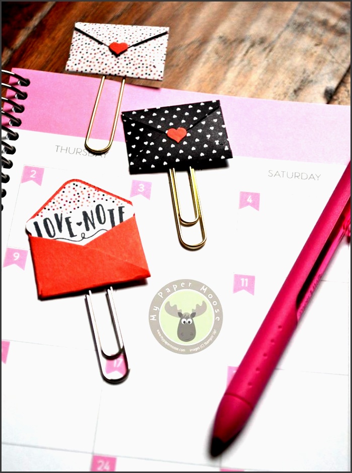cute mini envelope paper clips make the perfect bookmarks or planner clips using the love